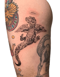 a tattoo of a crocodile with wings