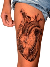 a tattoo of a human heart on a woman's thigh