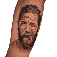 a tattoo of a man with a beard and a cigarette