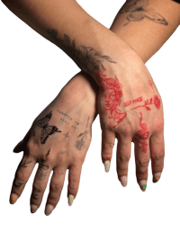 a woman's hands with tattoos on them