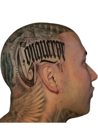 a man with a tattoo on his head with the word conqueror
