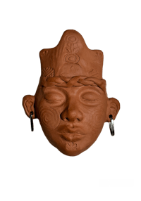 a clay mask with a crown on it