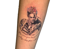 a tattoo of frida kahlo with a quote on it