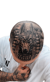 a man with an egyptian tattoo on his head