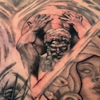 a tattoo of a man holding a woman's hand